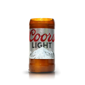 The Recycled Light Beer Candle is crafted from the top half of a brown Coors Light bottle, with the label and mountain graphic intact—an eco-friendly glass cup made from a repurposed beer candle.