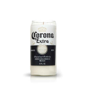 The Recycled Mexican-Style Beer Candle is a white, hand-poured candle in a glass made from a recycled beer bottle, featuring original Corona Extra branding for a distinctive Mexican flair.