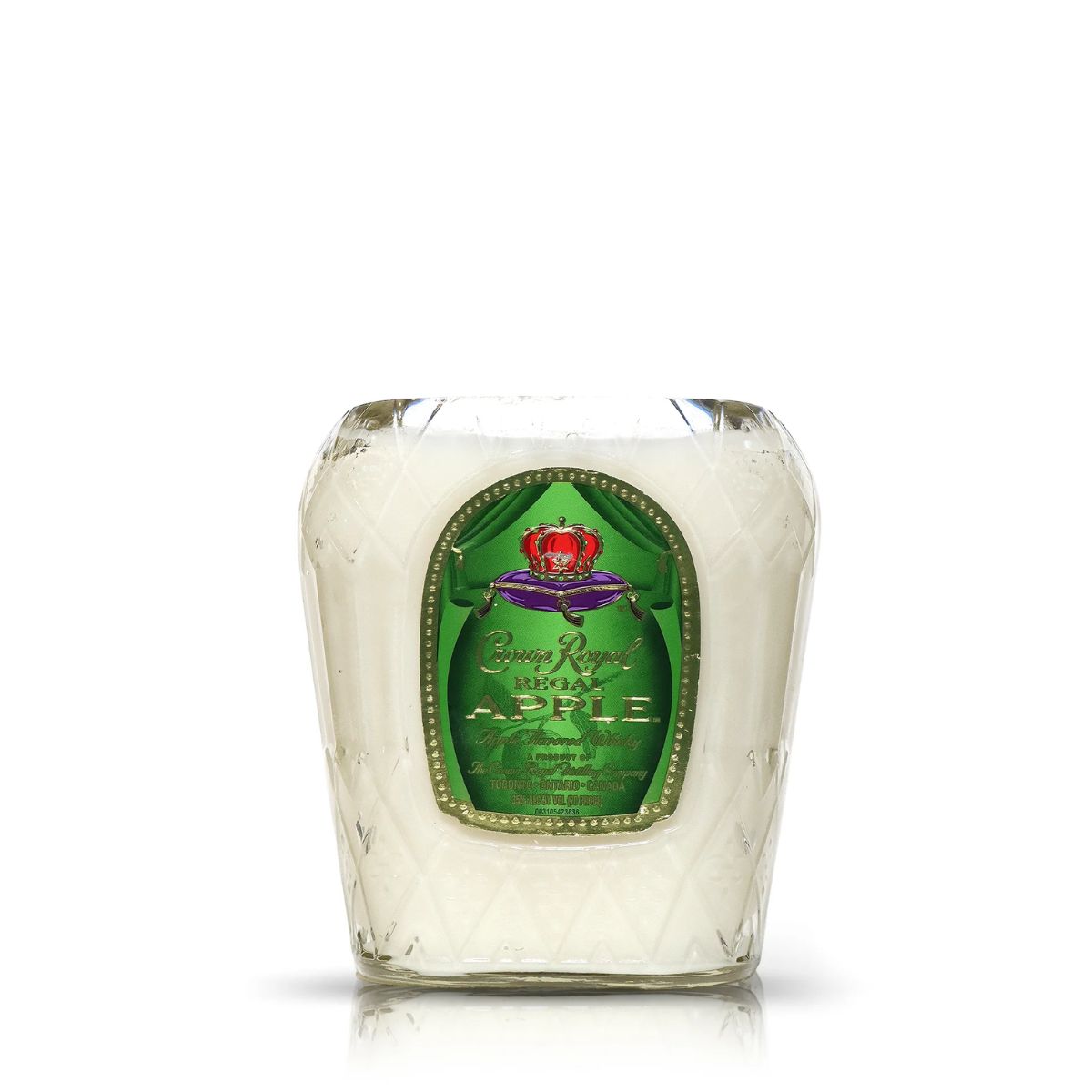 The Recycled Apple Whiskey Candle is a white coconut apricot wax candle in a clear glass holder with a green Crown Royal Regal Apple label, crafted from an upcycled whiskey bottle.