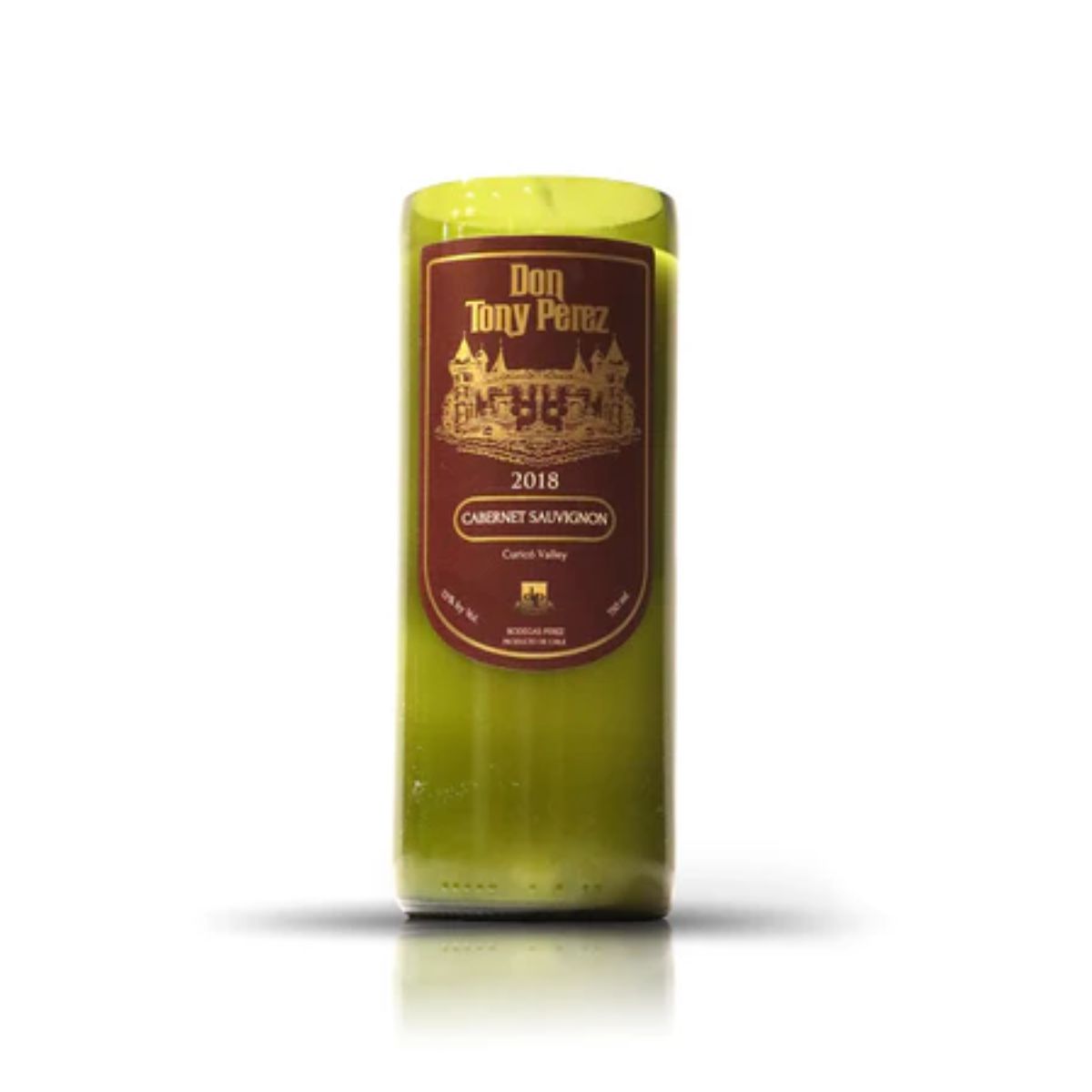 The Recycled Cabernet Wine Candle is made from an upcycled wine bottle with a brown and gold "Don Tony Perez 2018 Cabernet Sauvignon, Curicó Valley" label, blending eco-friendly style and artisanal craftsmanship.