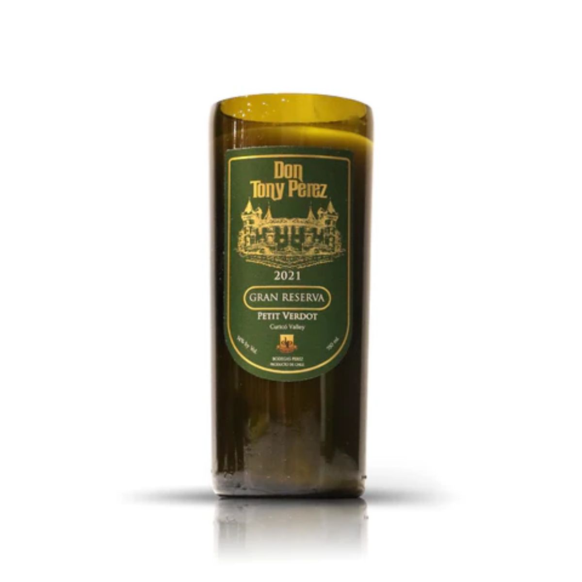 The Recycled Gran Reserva Wine Candle is a green candle holder made from a "Don Tony Perez 2021 Gran Reserva Petit Verdot" wine bottle—ideal for eco-friendly décor lovers and fans of unique, upcycled wine bottle candles.