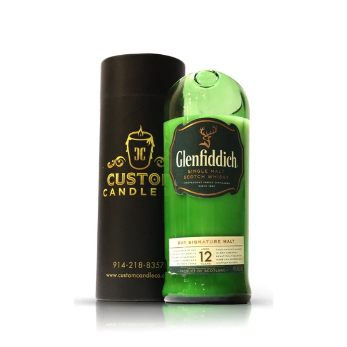 A Recycled Green Scotch Whiskey Candle stands next to a black cylindrical Custom Candle Co. container.