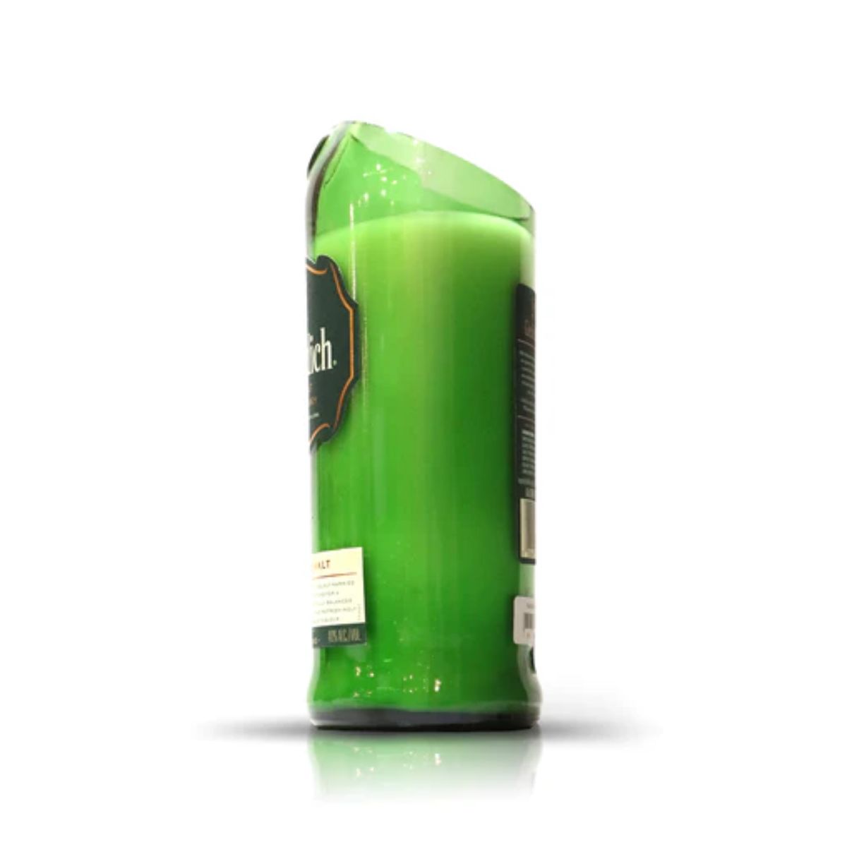 A Recycled Green Scotch Whiskey Candle in a tall glass jar with a melted, damaged top edge, displayed against a plain white background.