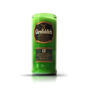 The Recycled Green Scotch Whiskey Candle is crafted in the shape of a Glenfiddich 12 Year Old bottle with the label visible, displayed against a plain white background.