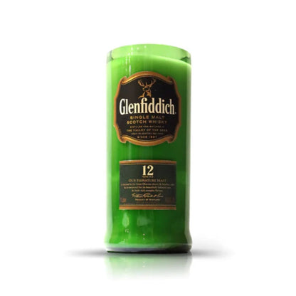 The Recycled Green Scotch Whiskey Candle is crafted in the shape of a Glenfiddich 12 Year Old bottle with the label visible, displayed against a plain white background.