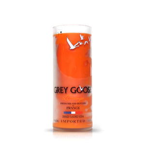 The Recycled French Vodka Candle - Orange features a bottle with a translucent orange label, white text, and bird graphics—perfect for crafting unique artisanal or recycled candles.