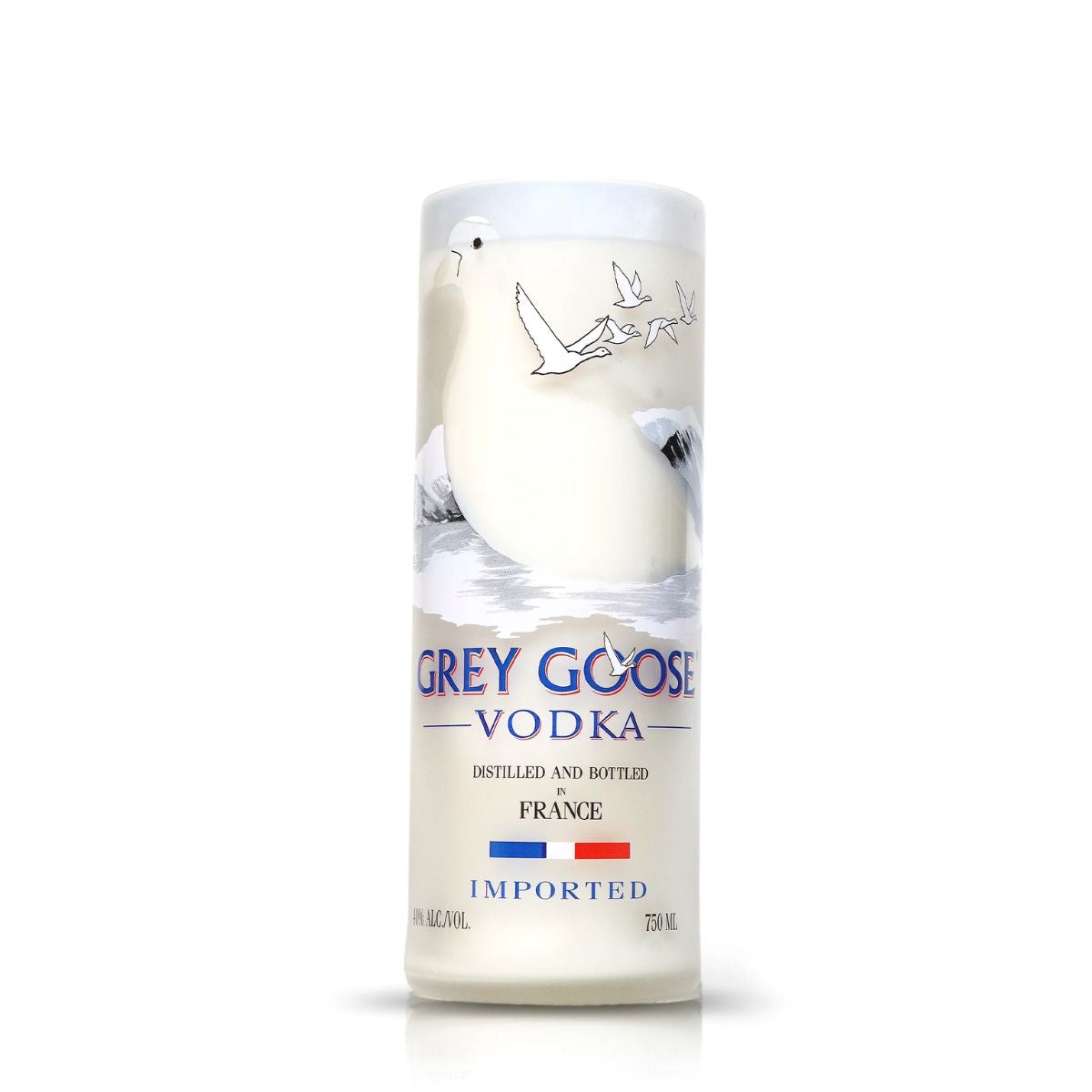 The Recycled French Vodka Candle - White is crafted from a Grey Goose Vodka bottle, showcasing the flying goose illustration and French branding—an eco-friendly, unique candle perfect for home décor.