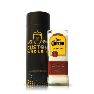 The Recycled Blue Agave Especial Tequila Candle sits in a glass marked "Jose Cuervo Especial" beside a "Custom Candle Co." container—a unique recycled candle ideal for fans of tequila bottle candles.