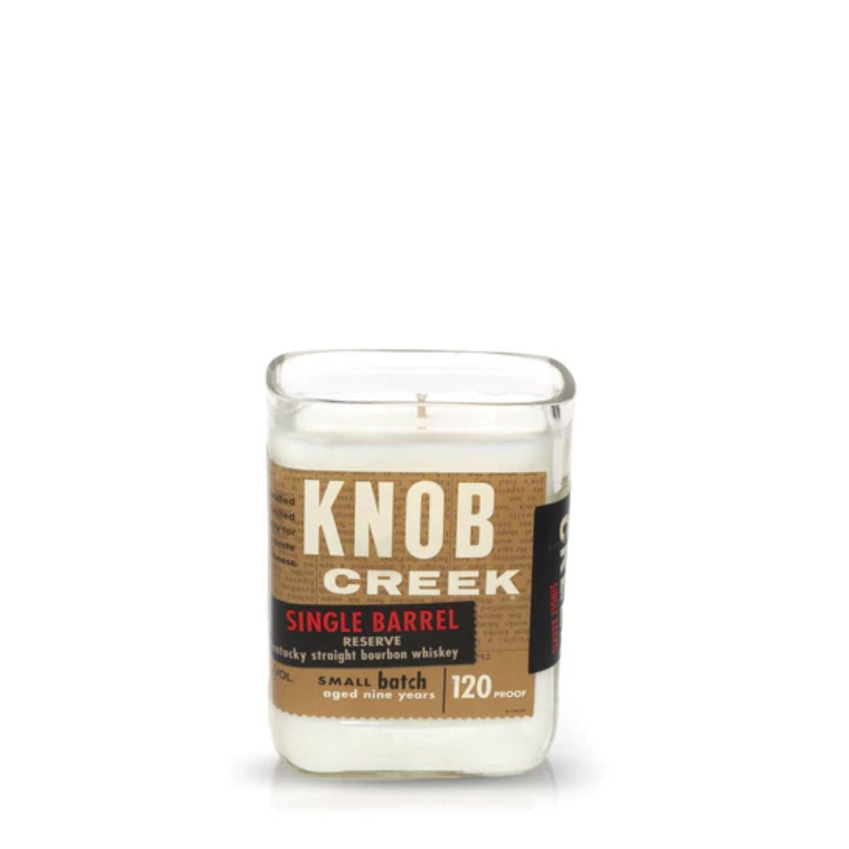 The Recycled Single Barrel Whiskey Candle is housed in a clear glass holder crafted from upcycled whiskey bottles and features an authentic Knob Creek Single Barrel whiskey label on the front.