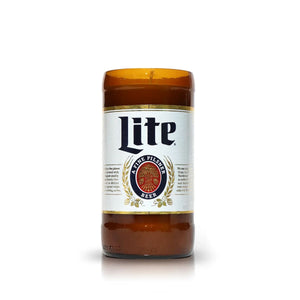 The Recycled Pilsner Beer Candle is hand-poured from an upcycled brown Lite beer bottle with its original label, displayed on a plain white background.