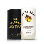A Recycled Caribbean Rum Candle in a white repurposed bottle sits beside a black Custom Candle Co. container, highlighting unique, artisanal, and eco-friendly candles.