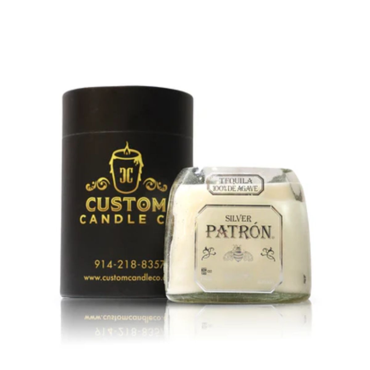 The Recycled Silver Agave Tequila Candle, made in a Patron Silver bottle, sits beside a sleek black "Custom Candle Co." container—showcasing stylish candle craftsmanship from recycled glass.