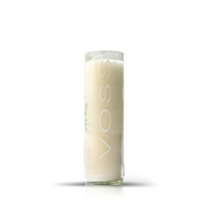 A Recycled Lime Mint Sparkling Water Candle, crafted from an upcycled bottle, is displayed on a white background—an ideal decorative inspiration for stylish home decor enthusiasts.
