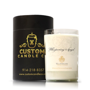 A white Recycled 2018 Rosé Wine Candle, made from eco-friendly upcycled wine bottles, is paired with a sleek black cylindrical box displaying gold "Custom Candle Co" branding and contact details.