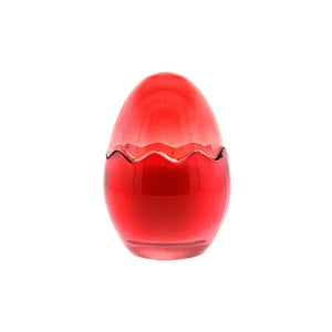 The Red Glass Easter Egg is a red, egg-shaped glass candle with a zigzag pattern around its widest part, made from natural wax and shown from the front against a white background.
