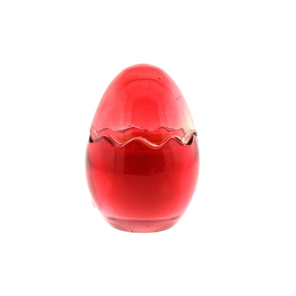 The Red Glass Easter Egg w/ Yoke is an egg-shaped candle with a wavy seam, crafted from natural wax and shown against a white background.