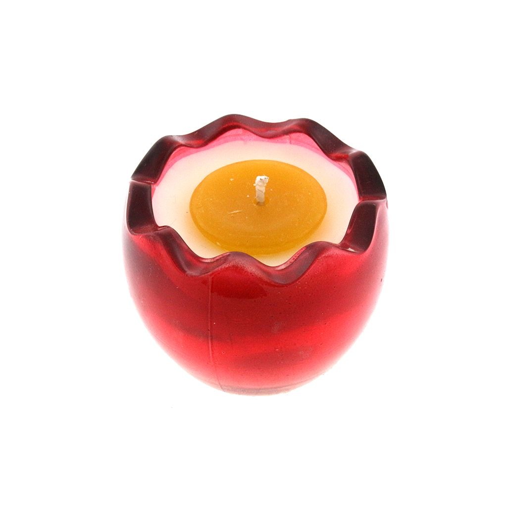 The Red Glass Easter Egg w/ Yoke features a yellow and white, egg-shaped natural wax candle inside a red glass holder, viewed from above.
