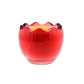 The Red Glass Easter Egg w/ Yoke is a red glass candle holder with a wavy rim, holding an egg-shaped natural wax candle with a visible central wick.