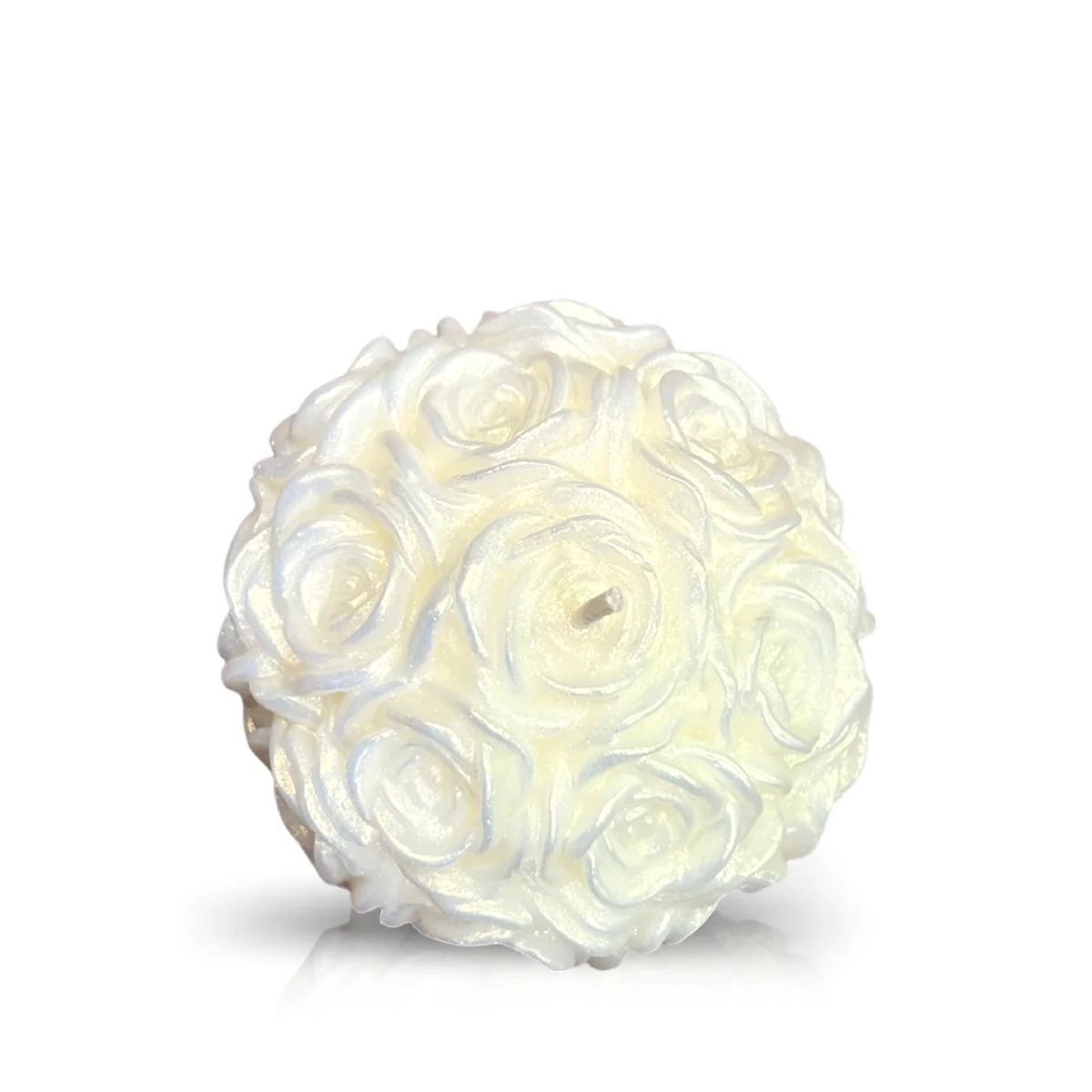 The Silver Shimmer - White Rose Candle is a hand-poured, round candle designed as a cluster of roses, featuring a single wick at the center and displayed against a plain white background.
