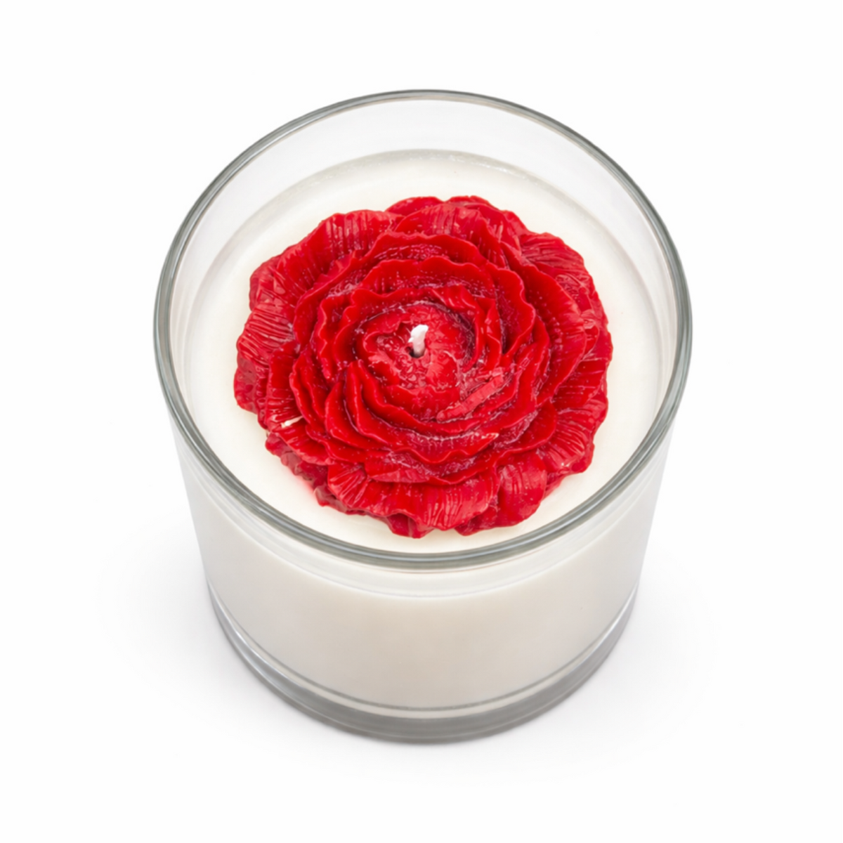 The Rose Blossom Candle is a handcrafted, all-natural soy candle in white, topped with a red wax rose and presented in a glass container.