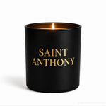 Black candle with 'Saint Anthony' in gold text on a white background, featuring the brand 'customcandlecoins'.