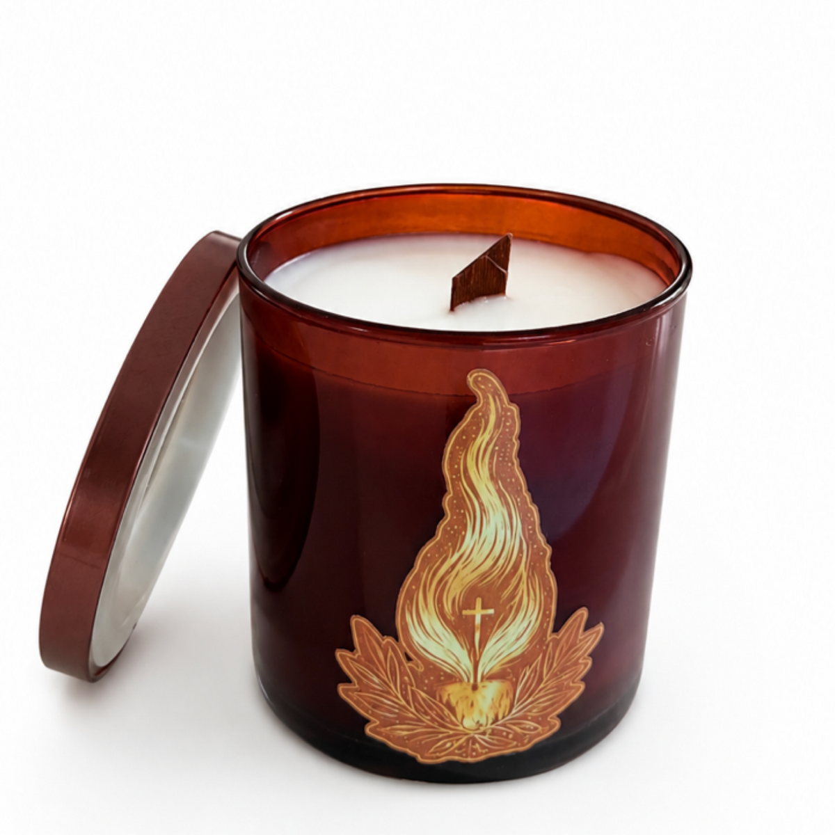 Candle in a decorative amber jar with a flame design on a white background