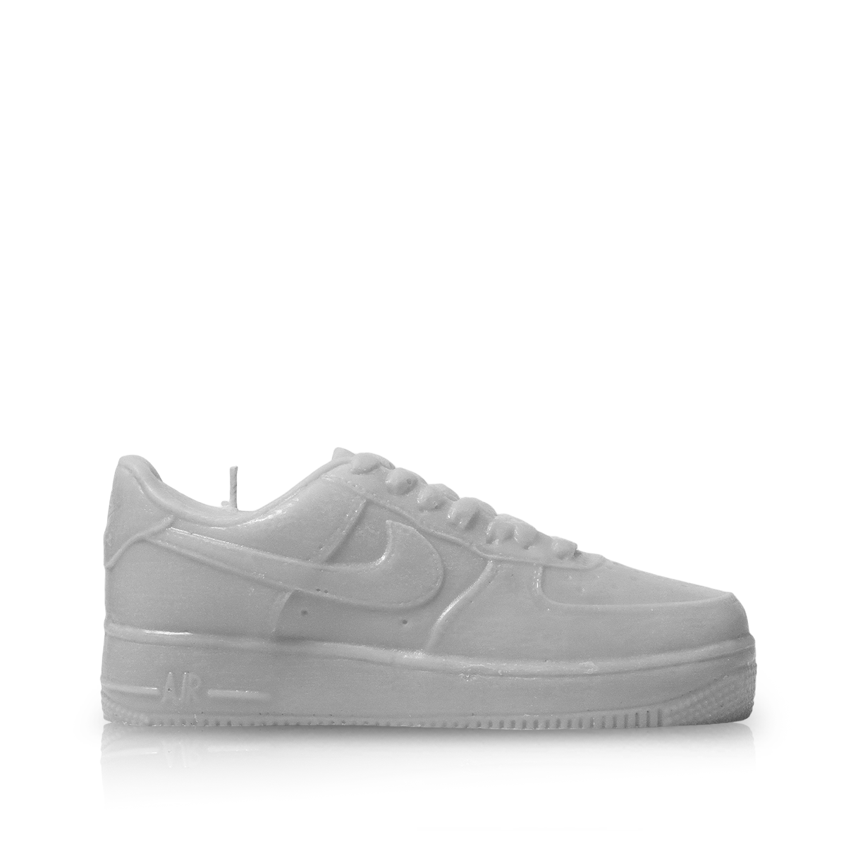 The Air Force 1 Small Sneaker Candle (On Backorder), shaped like the iconic white sneaker, is shown in profile against a plain white background. This hand-poured piece captures every detail for unique and stylish decor.