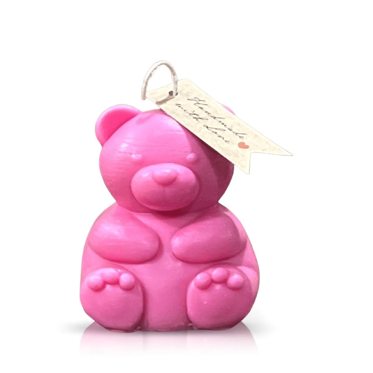 The Teddy Bear Pastel Pink Chubby Candle, shaped like a teddy with a tag on its ear, is photographed against a white background—ideal for adding whimsical charm to your home decor.
