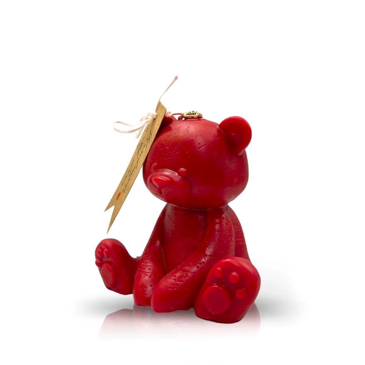 The Teddy Bear Red Baby Candle is an upright red bear-shaped natural wax candle with a tag on its head—perfect as a Valentine’s Day gift.