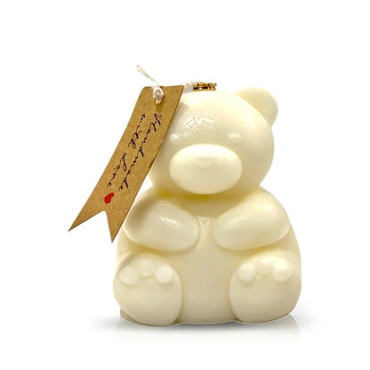 The Teddy Bear White Chubby Candle features a bear shape with a brown paper tag tied to its ear, set against a white background—a delightful decor piece or thoughtful Valentine’s Day gift.