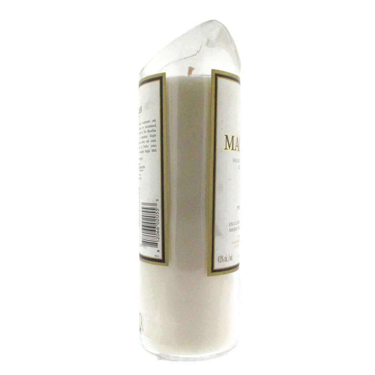 The Recycled Highland Scotch Whiskey Candle is a white pillar candle in a clear, slant-topped glass made from upcycled whiskey bottles, featuring a barcode and label on the side.