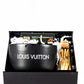 The LV Candle Designer Gift Set features a black Louis Vuitton candle, a jar of matches, and a gift card in a black box with white shredded paper—an elegant custom candle gift for any occasion.