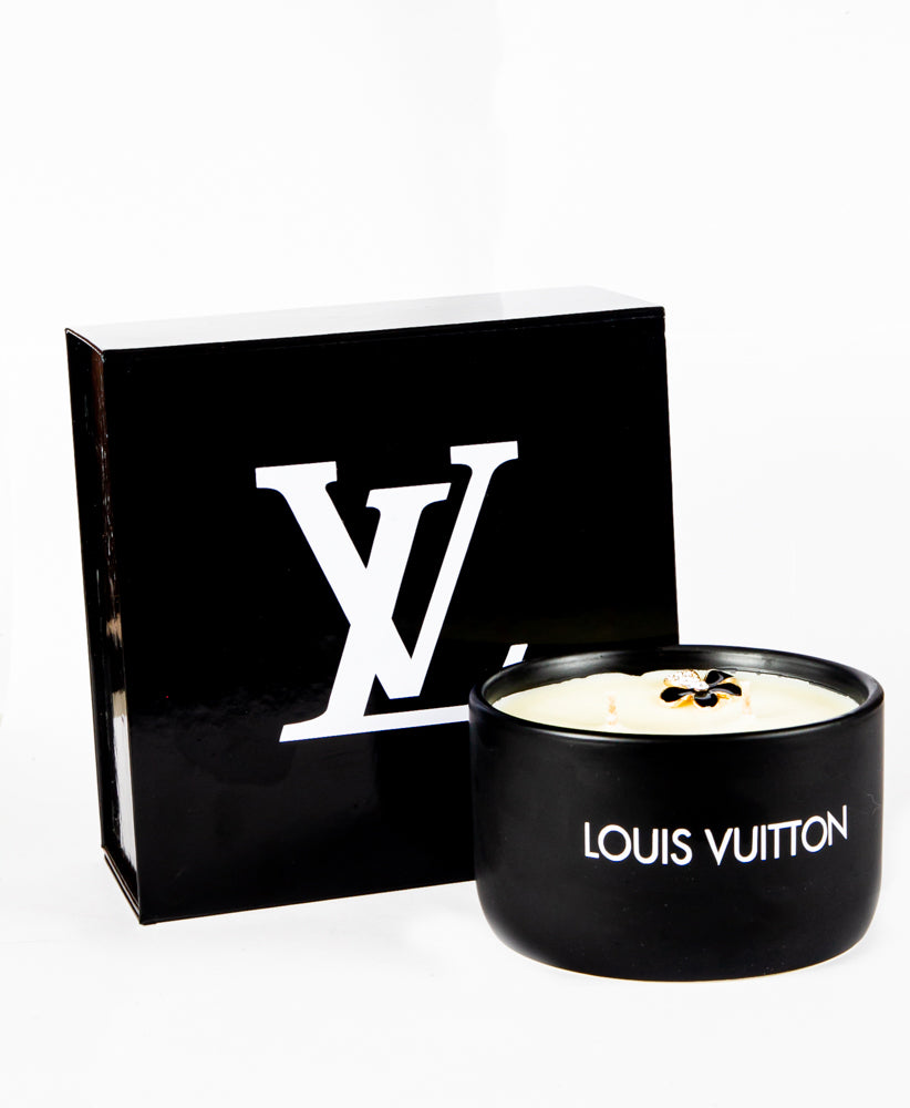 The LV Candle Designer Gift Set features a black soy wax candle paired with a matching box, both showcasing the bold white LV logo—a luxurious custom gift.