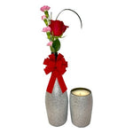The Valentine’s Luxourious Gift Set – Silver Diamond set features a silver diamond vase with a red rose, pink flowers, red bow, matching candle holder, and champagne-scented candle—an elegant Valentine’s gift.