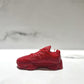 The Y500 – Red Sneaker Candle – Small (currently on backorder) is displayed on a white surface with a blurred background.