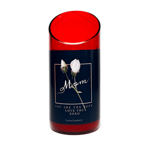 The "Mom You're the Best" Candle is a custom red glass candle holder featuring a floral design and the words “Mom, You are the best, love you XOXO” printed on the front.