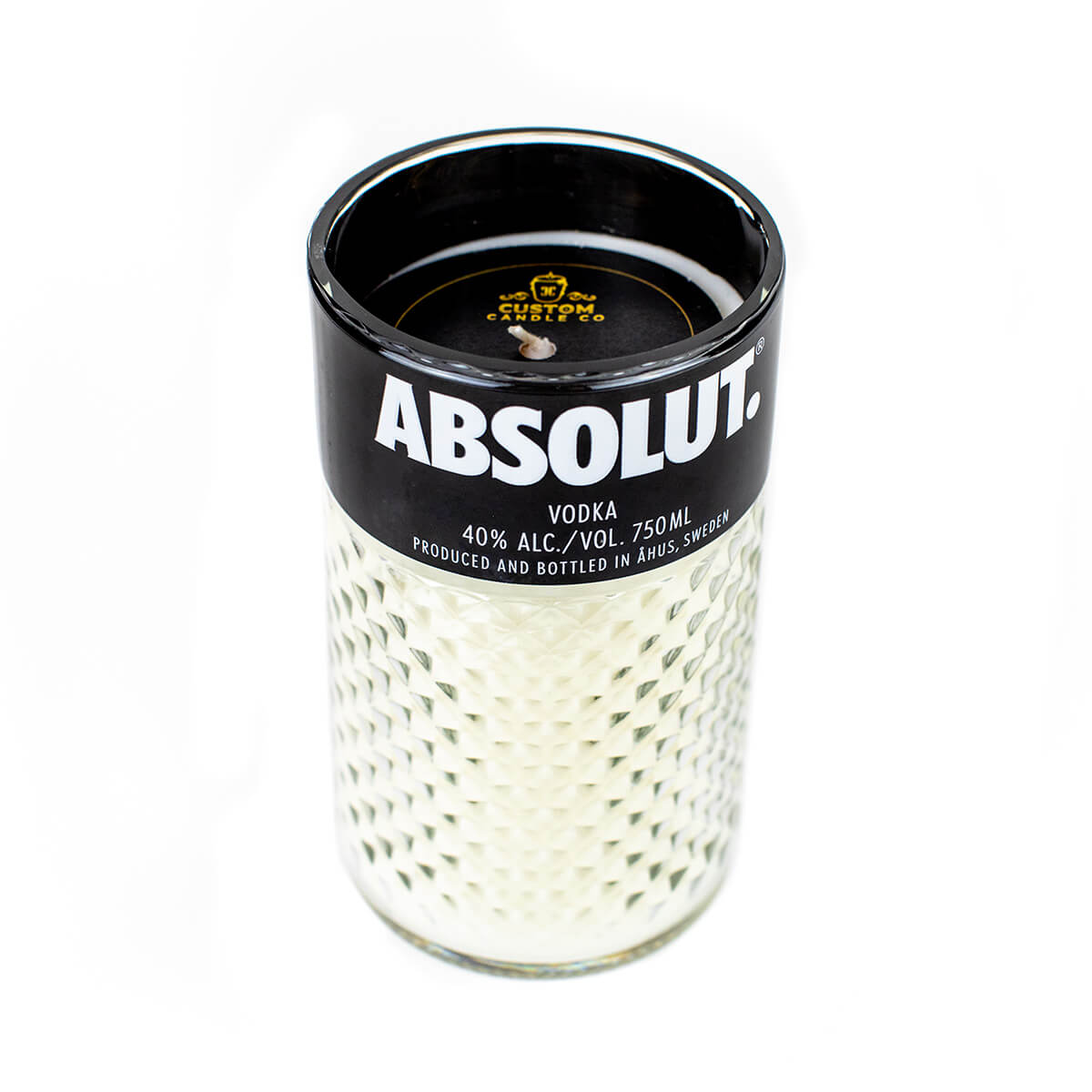 A white textured natural soy candle in a glass container featuring the Black Label Vodka branding, crafted as a Recycled Black Label Vodka Candle with a visible wick at the top.