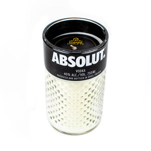 A white textured natural soy candle in a glass container featuring the Black Label Vodka branding, crafted as a Recycled Black Label Vodka Candle with a visible wick at the top.