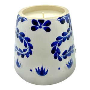 The Recycled Azul Tequila Candle features a white ceramic holder with a blue floral pattern and a hand-poured, cruelty-free soy candle with one unused wick.
