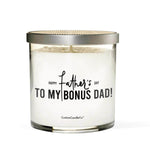 The "To My Bonus Dad!" soy candle comes in a glass jar with a silver lid. The label says, "Happy Father's Day to my bonus dad!" above "CustomCandleCo®"—a thoughtful, custom gift perfect for dad.