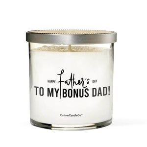 The "To My Bonus Dad!" soy candle comes in a glass jar with a silver lid. The label says, "Happy Father's Day to my bonus dad!" above "CustomCandleCo®"—a thoughtful, custom gift perfect for dad.