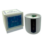 The Holiday Scented Boxed Candle – Blue Spruce Scent is a white soy wax candle with a blue spruce fragrance, packaged in a matching box. A small green tree decorates the wick, adding a festive touch to your holiday scented candle collection.