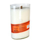 The Recycled Kentucky Bourbon Whiskey Candle features a white candle with a wooden wick, poured in a recycled whiskey bottle container. It has an orange label with text and recycling symbols.