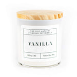 The VANILLA Relaxing Aromatherapy Candle 11oz is a white candle in a glass jar with wooden lid, labeled "Vanilla." Made from natural soy wax and infused with 100mg CBD, it offers a relaxing aromatherapy experience.