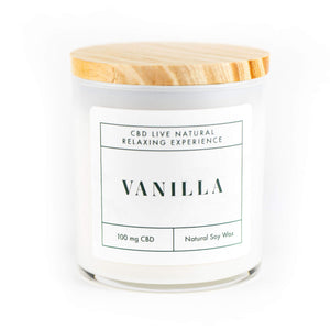 The VANILLA Relaxing Aromatherapy Candle 11oz is a white candle in a glass jar with wooden lid, labeled "Vanilla." Made from natural soy wax and infused with 100mg CBD, it offers a relaxing aromatherapy experience.