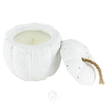 The White Cement Pumpkin Candle features a removable lid with a brown rope stem, revealing a white pumpkin candle inside. The lid sits beside this charming piece, perfect for adding cozy decor to any space.