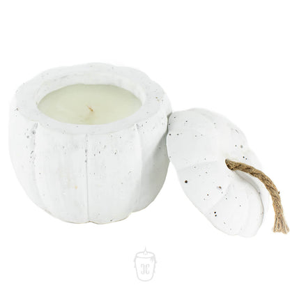 The White Cement Pumpkin Candle features a removable lid with a brown rope stem, revealing a white pumpkin candle inside. The lid sits beside this charming piece, perfect for adding cozy decor to any space.