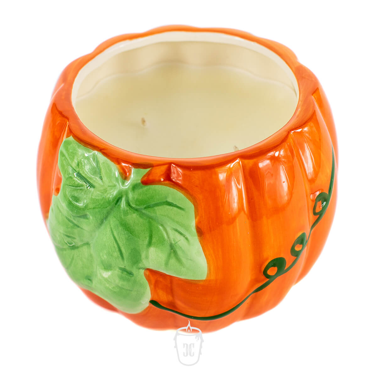 The Ceramic Large Leaf Pumpkin Candle is an orange ceramic candle holder with green leaf and vine details, featuring a wax candle inside—perfect for adding cozy, seasonal charm to your home.