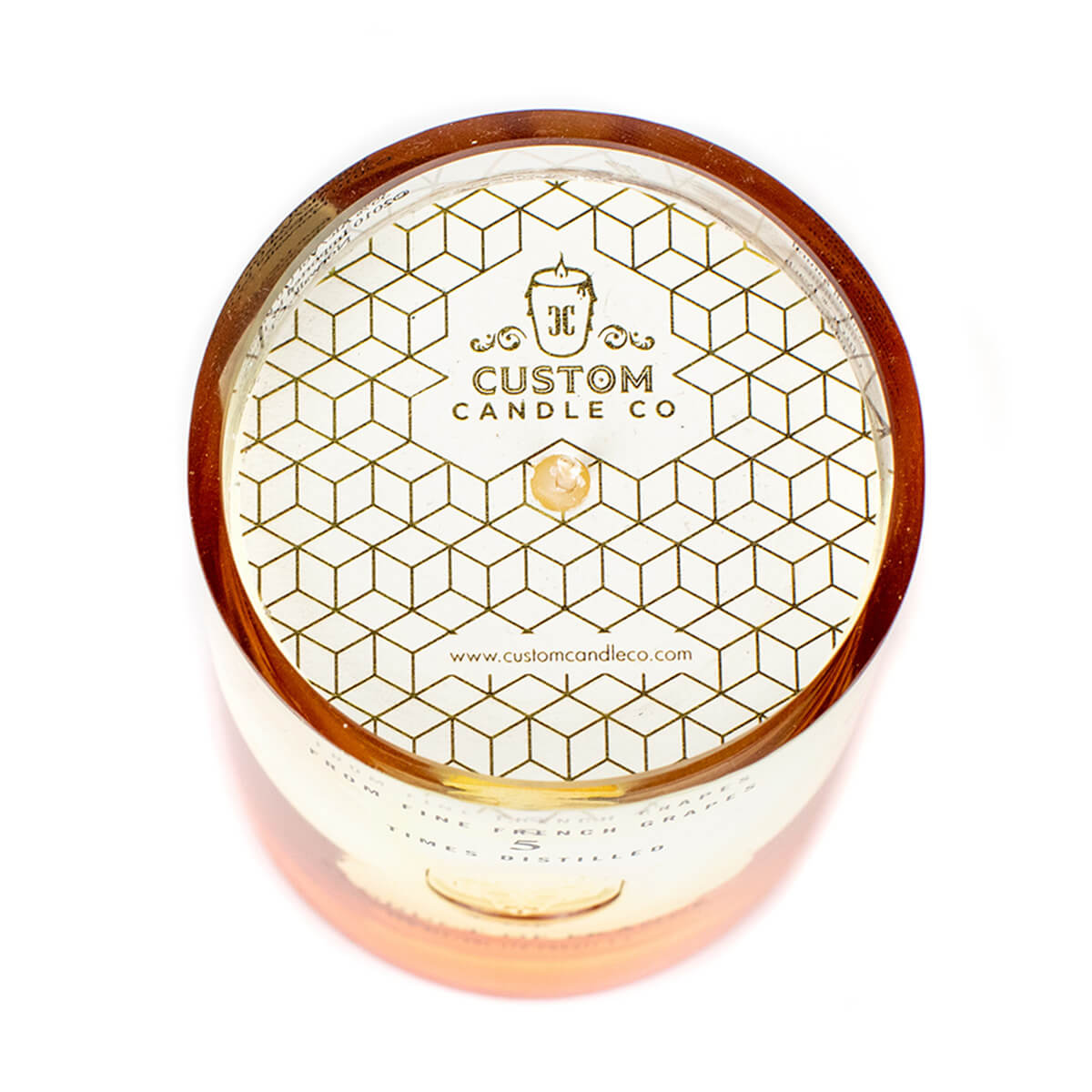 A top-down view of a multi-color Recycled Vodka Candle in a brown custom jar with a geometric gold-patterned lid, featuring the Custom Candle Co. logo and website—ideal for unique soy candle lovers.