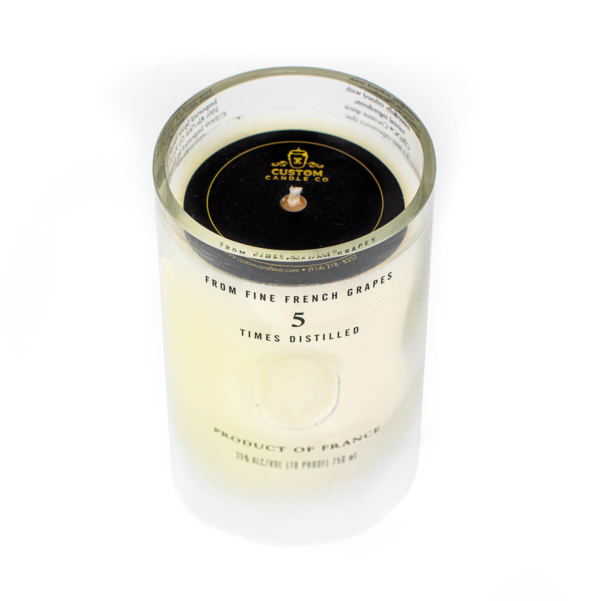The Recycled Vodka Candle – Multi-color is crafted from a clear glass vodka bottle with a black and gold cap, once labeled “From fine French grapes, 5 times distilled.” Ideal as a unique candle centerpiece or creative home décor.